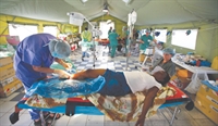 A patient receives medical treatment at a field hospital in Port-au-Prince, Haiti.