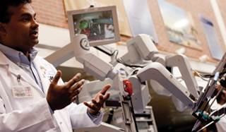 Sijo Parakattil, MD, and the robotic system he uses to perform RAVV. Sijo Parakattil, MD, and the robotic system he uses to perform RAVV.